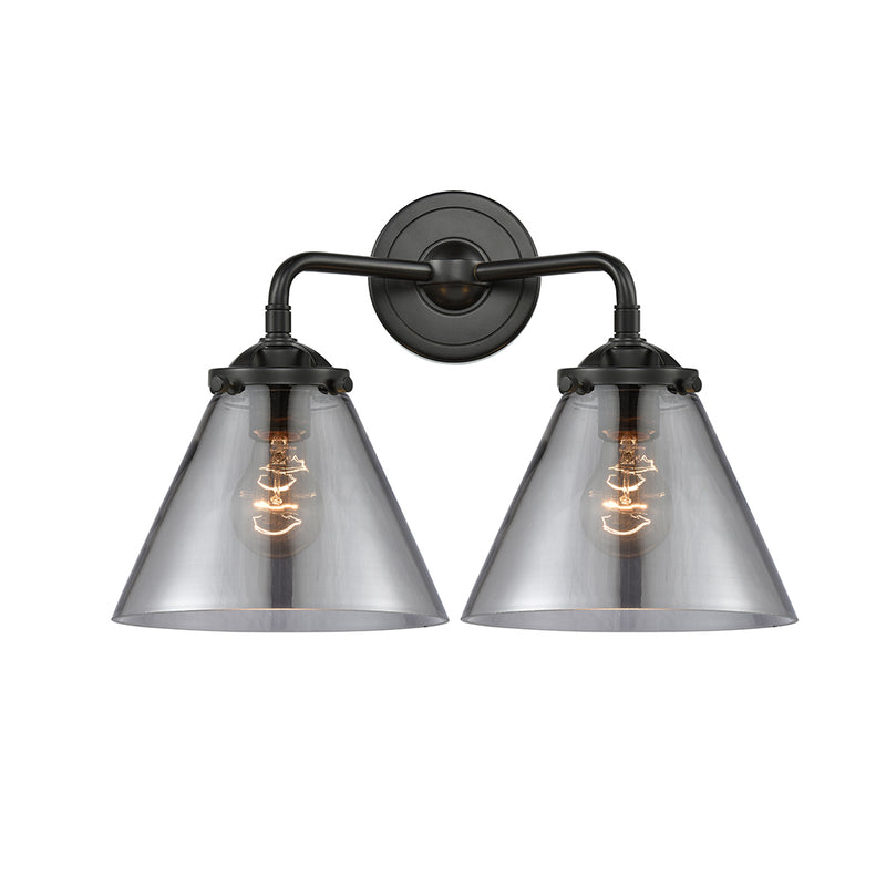 Cone Bath Vanity Light shown in the Oil Rubbed Bronze finish with a Plated Smoke shade