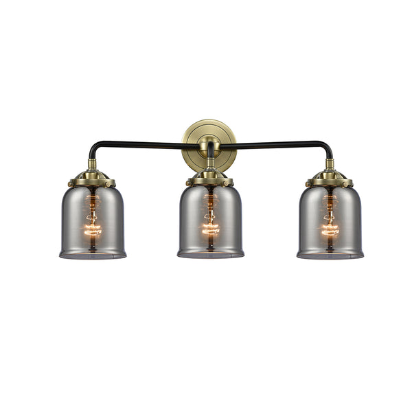 Bell Bath Vanity Light shown in the Black Antique Brass finish with a Plated Smoke shade