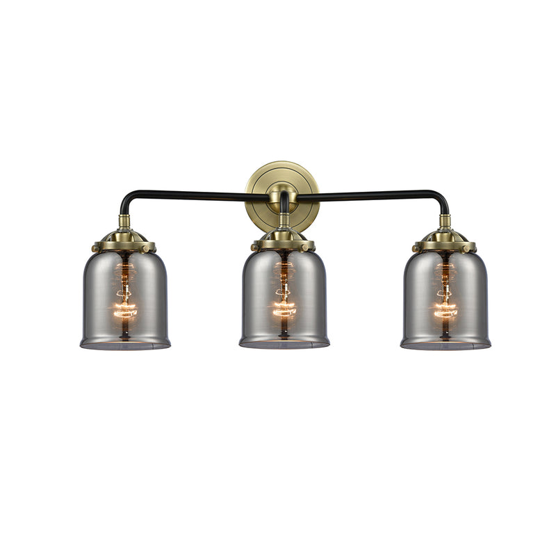 Bell Bath Vanity Light shown in the Black Antique Brass finish with a Plated Smoke shade