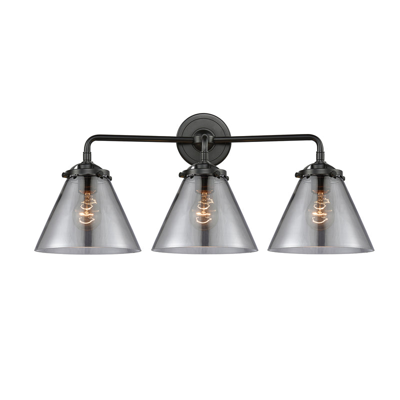 Cone Bath Vanity Light shown in the Oil Rubbed Bronze finish with a Plated Smoke shade