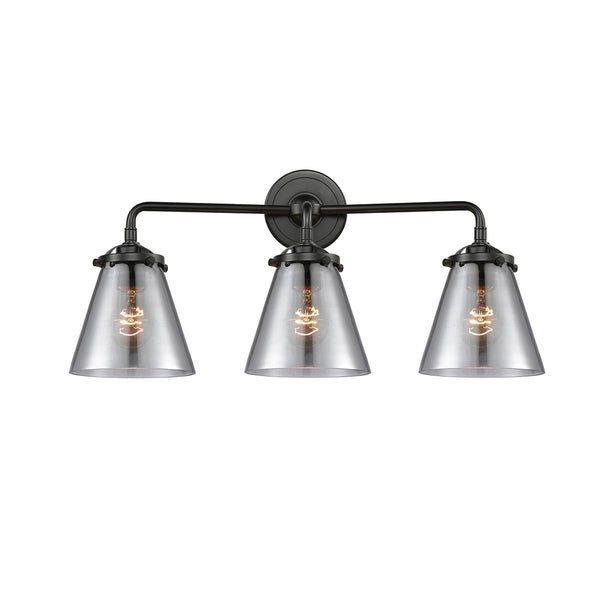 Cone Bath Vanity Light shown in the Oil Rubbed Bronze finish with a Plated Smoke shade