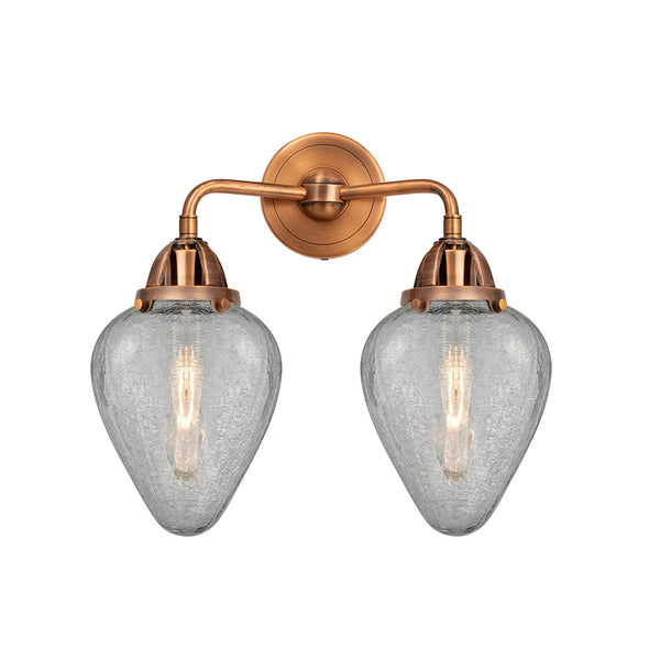 Geneseo Bath Vanity Light shown in the Antique Copper finish with a Clear Crackled shade