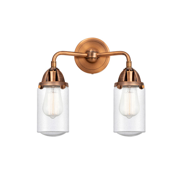 Dover Bath Vanity Light shown in the Antique Copper finish with a Seedy shade