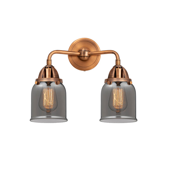 Bell Bath Vanity Light shown in the Antique Copper finish with a Plated Smoke shade