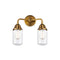 Dover Bath Vanity Light shown in the Brushed Brass finish with a Clear shade