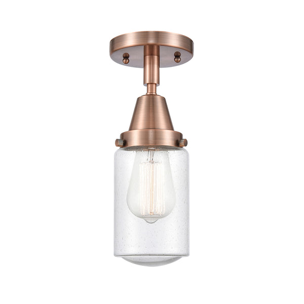 Dover Flush Mount shown in the Antique Copper finish with a Seedy shade