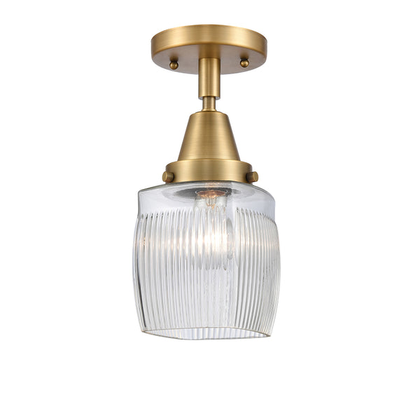 Colton Flush Mount shown in the Brushed Brass finish with a Clear Halophane shade