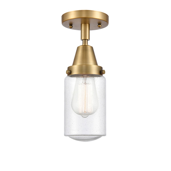 Dover Flush Mount shown in the Brushed Brass finish with a Seedy shade