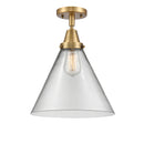 Cone Flush Mount shown in the Brushed Brass finish with a Clear shade