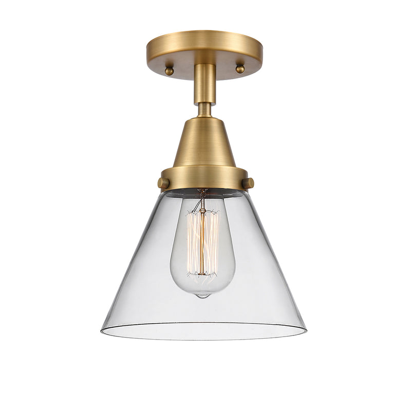 Cone Flush Mount shown in the Brushed Brass finish with a Clear shade