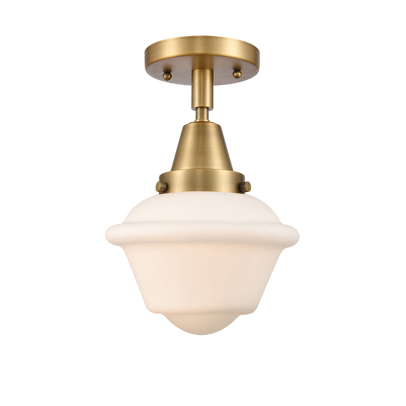 Oxford Flush Mount shown in the Brushed Brass finish with a Matte White shade