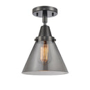 Cone Flush Mount shown in the Matte Black finish with a Plated Smoke shade