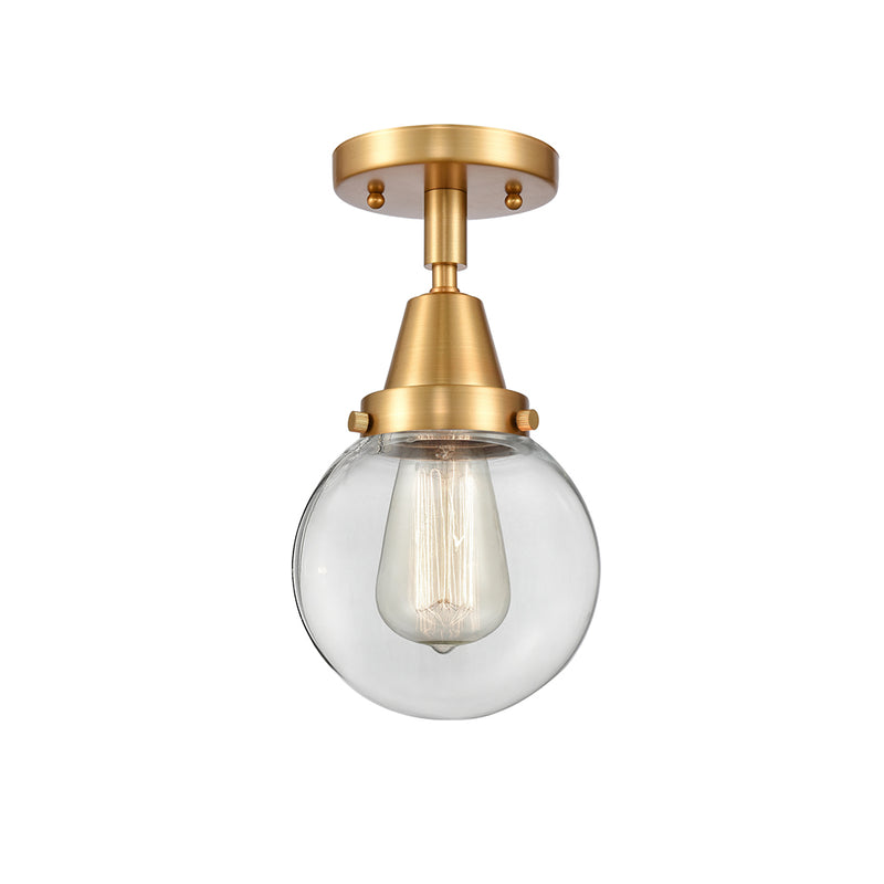 Beacon Flush Mount shown in the Satin Gold finish with a Clear shade