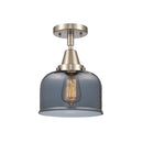 Bell Flush Mount shown in the Brushed Satin Nickel finish with a Plated Smoke shade