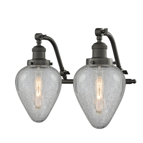 Geneseo Bath Vanity Light shown in the Oil Rubbed Bronze finish with a Clear Crackled shade