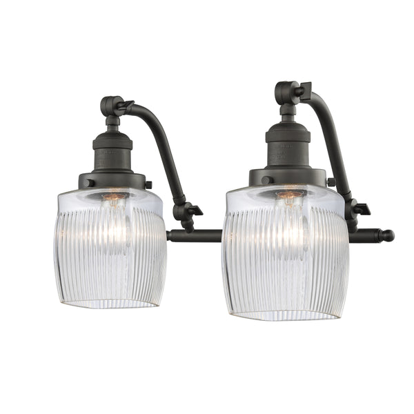 Colton Bath Vanity Light shown in the Oil Rubbed Bronze finish with a Clear Halophane shade