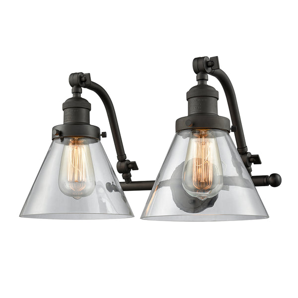 Cone Bath Vanity Light shown in the Oil Rubbed Bronze finish with a Clear shade