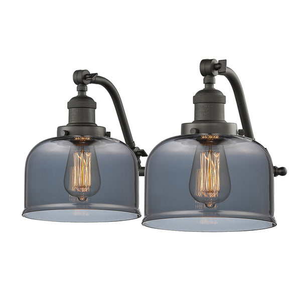 Bell Bath Vanity Light shown in the Oil Rubbed Bronze finish with a Plated Smoke shade