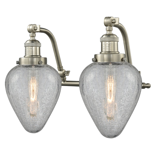Geneseo Bath Vanity Light shown in the Brushed Satin Nickel finish with a Clear Crackled shade