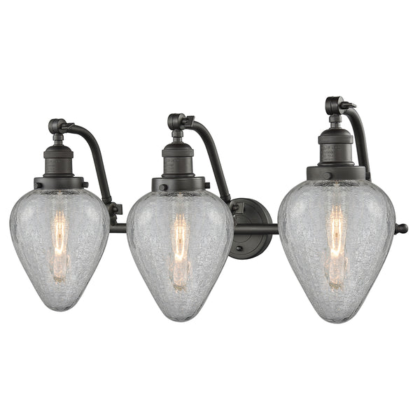 Geneseo Bath Vanity Light shown in the Oil Rubbed Bronze finish with a Clear Crackled shade