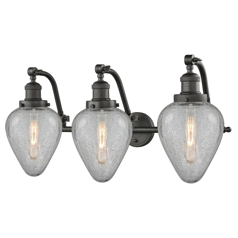 Geneseo Bath Vanity Light shown in the Oil Rubbed Bronze finish with a Clear Crackled shade