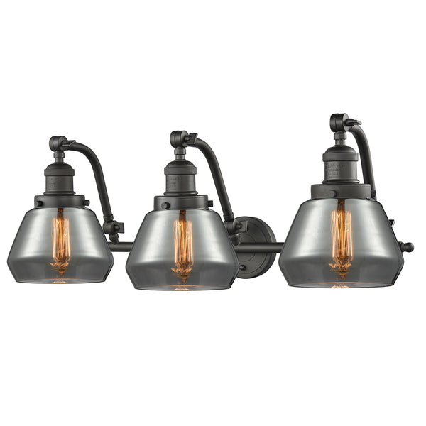 Fulton Bath Vanity Light shown in the Oil Rubbed Bronze finish with a Plated Smoke shade