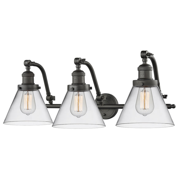 Cone Bath Vanity Light shown in the Oil Rubbed Bronze finish with a Clear shade