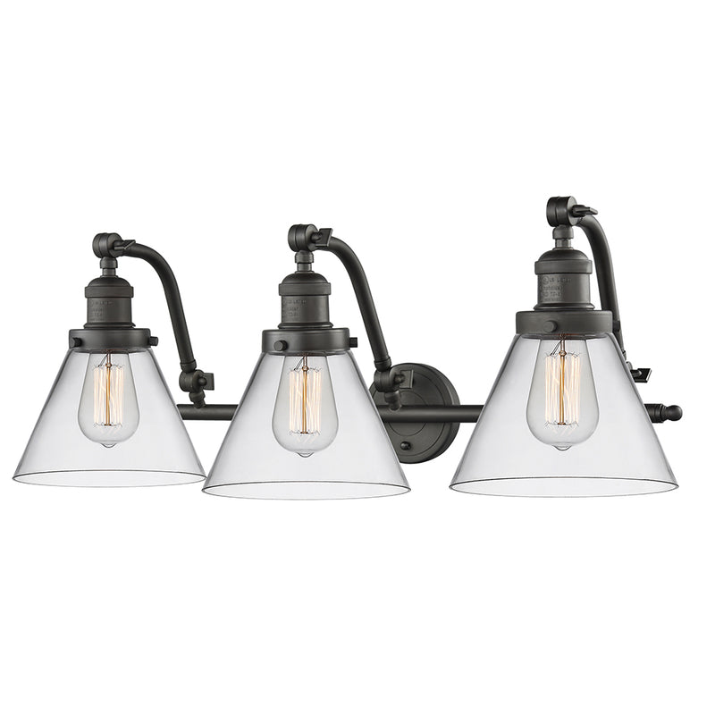 Cone Bath Vanity Light shown in the Oil Rubbed Bronze finish with a Clear shade