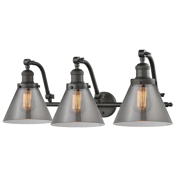 Cone Bath Vanity Light shown in the Oil Rubbed Bronze finish with a Plated Smoke shade