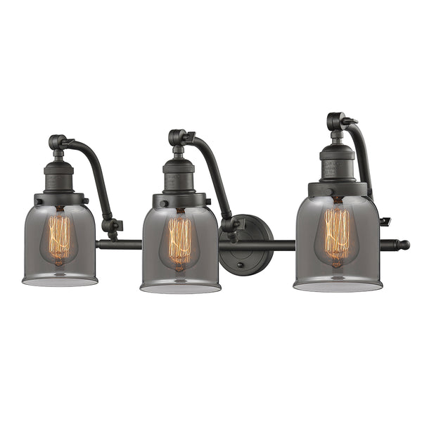 Bell Bath Vanity Light shown in the Oil Rubbed Bronze finish with a Plated Smoke shade