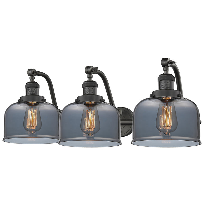 Bell Bath Vanity Light shown in the Oil Rubbed Bronze finish with a Plated Smoke shade