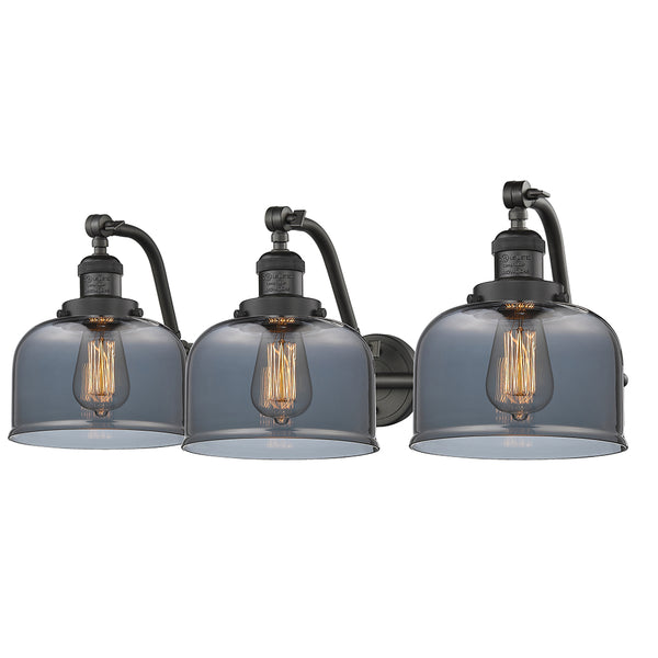 Bell Bath Vanity Light shown in the Oil Rubbed Bronze finish with a Plated Smoke shade