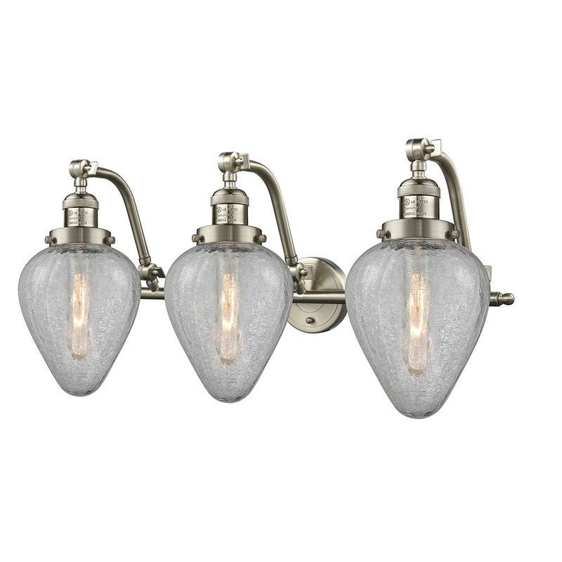 Geneseo Bath Vanity Light shown in the Brushed Satin Nickel finish with a Clear Crackled shade