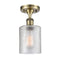 Cobbleskill Semi-Flush Mount shown in the Antique Brass finish with a Clear shade