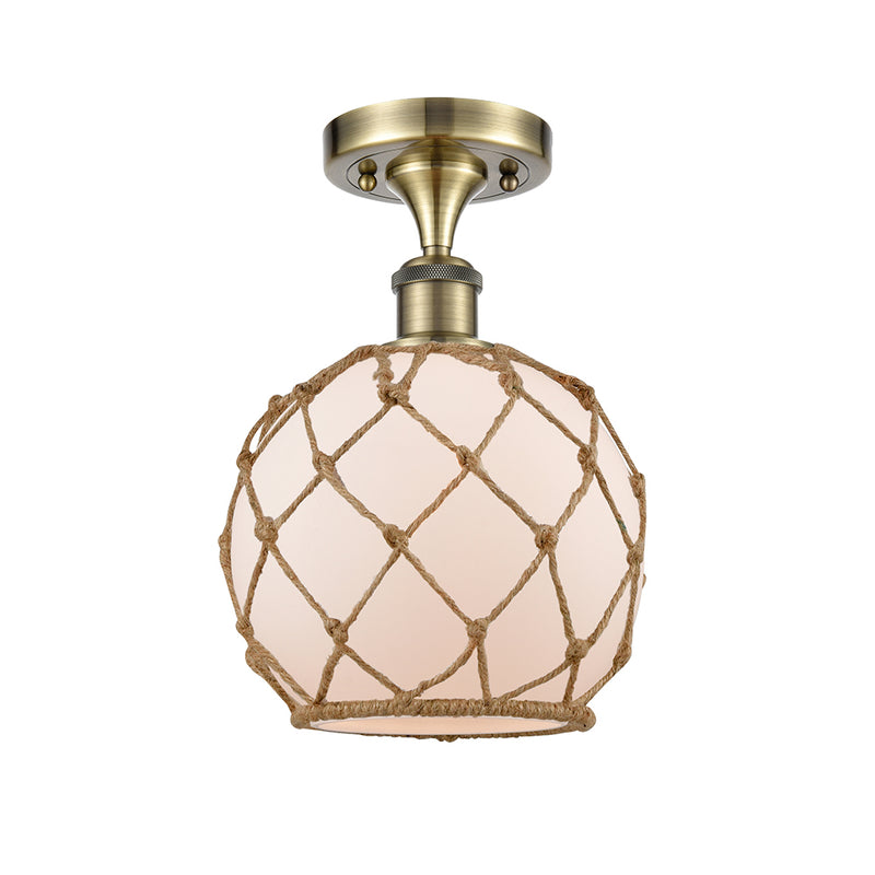 Farmhouse Rope Semi-Flush Mount shown in the Antique Brass finish with a White Glass with Brown Rope shade