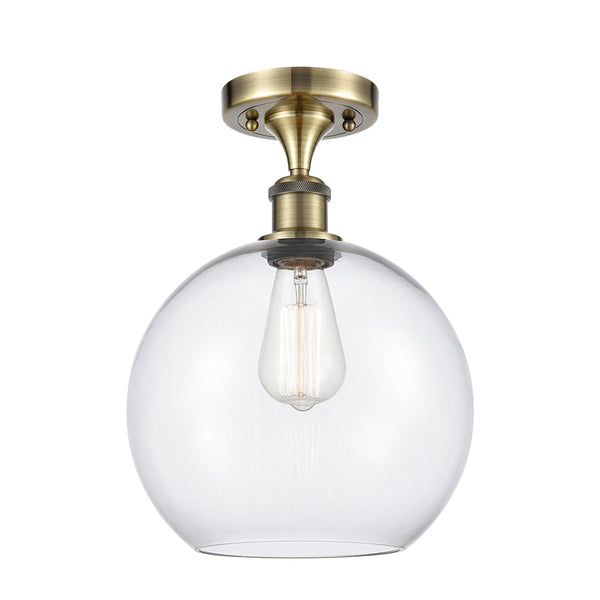 Athens Semi-Flush Mount shown in the Antique Brass finish with a Clear shade