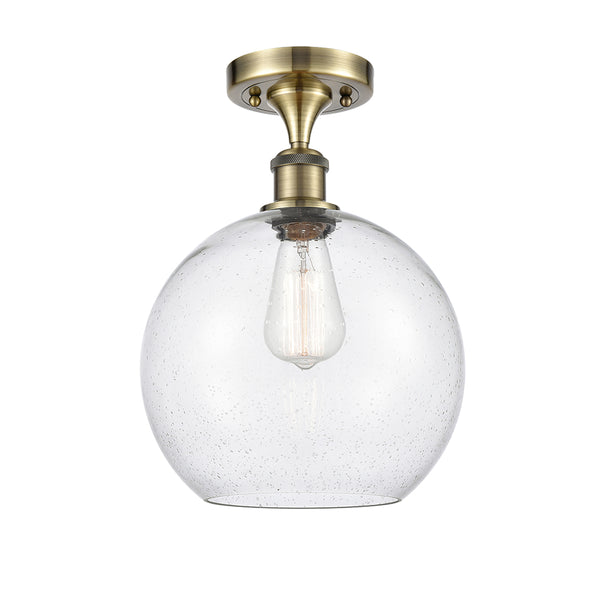 Athens Semi-Flush Mount shown in the Antique Brass finish with a Seedy shade