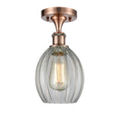 Eaton Semi-Flush Mount shown in the Antique Copper finish with a Clear shade