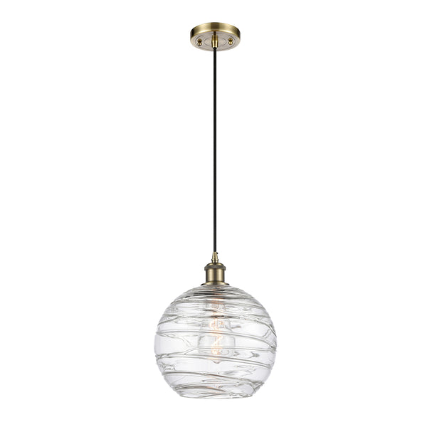 Deco Swirl Mini Pendant shown in the Antique Brass finish with a Clear shade