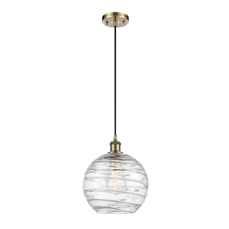 Deco Swirl Mini Pendant shown in the Antique Brass finish with a Clear shade