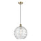 Deco Swirl Mini Pendant shown in the Antique Brass finish with a Clear shade