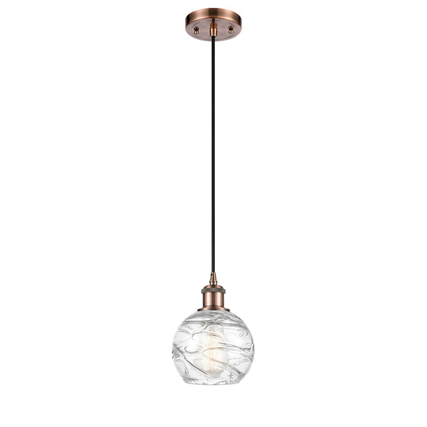 Deco Swirl Mini Pendant shown in the Antique Copper finish with a Clear shade