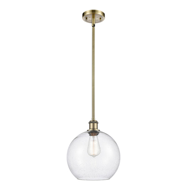 Athens Mini Pendant shown in the Antique Brass finish with a Seedy shade