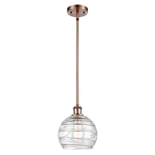 Deco Swirl Mini Pendant shown in the Antique Copper finish with a Clear shade