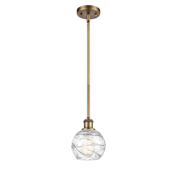 Deco Swirl Mini Pendant shown in the Brushed Brass finish with a Clear shade
