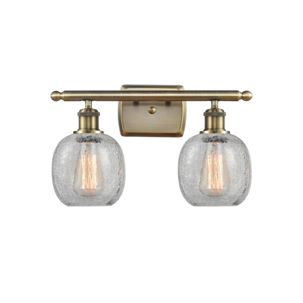 Belfast Bath Vanity Light shown in the Antique Brass finish with a Clear Crackle shade