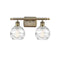 Deco Swirl Bath Vanity Light shown in the Antique Brass finish with a Clear shade