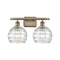 Deco Swirl Bath Vanity Light shown in the Antique Brass finish with a Clear shade