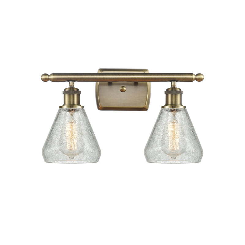 Conesus Bath Vanity Light shown in the Antique Brass finish with a Clear Crackle shade