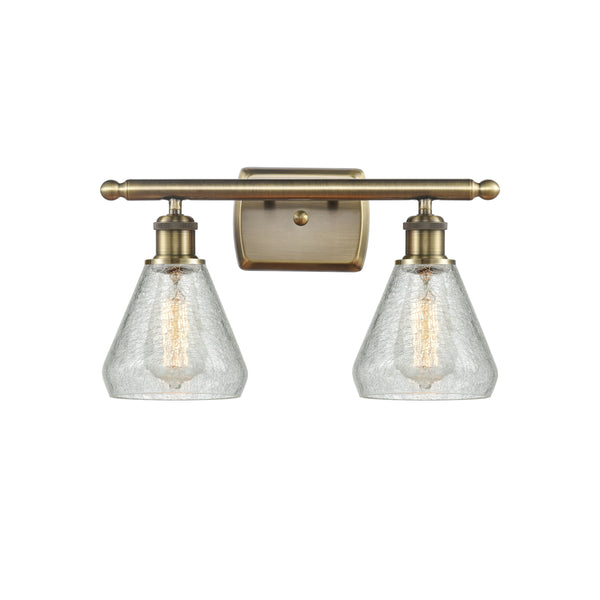 Conesus Bath Vanity Light shown in the Antique Brass finish with a Clear Crackle shade